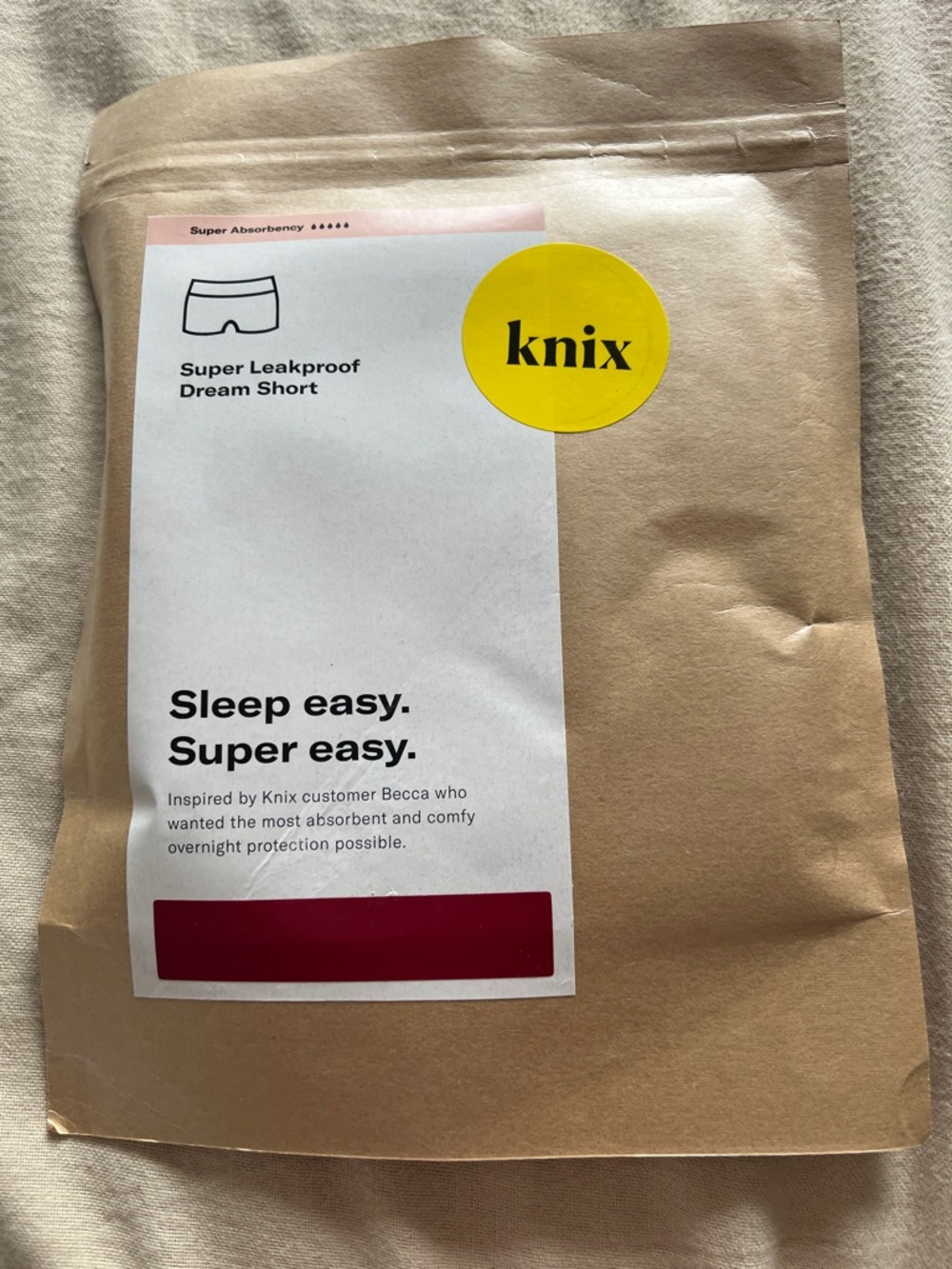 knix kraft pouch with yellow logo and white label